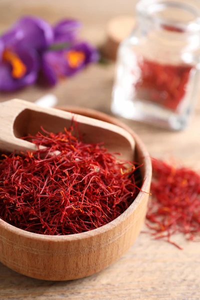 Saffron flower and seed in wooden container